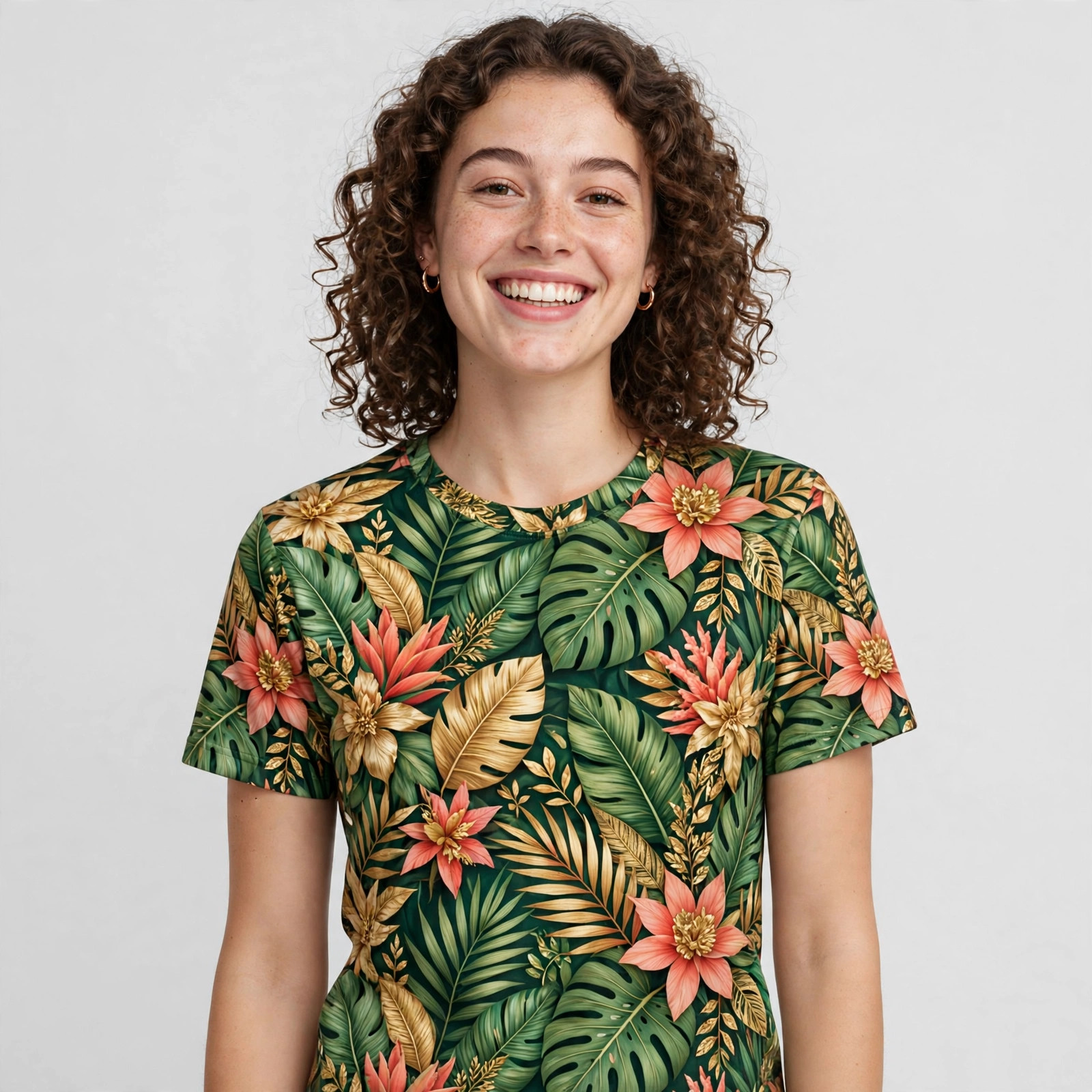 Model wearing an all-over print sublimated T-shirt with a tropical pattern covering the shirt seam to seam